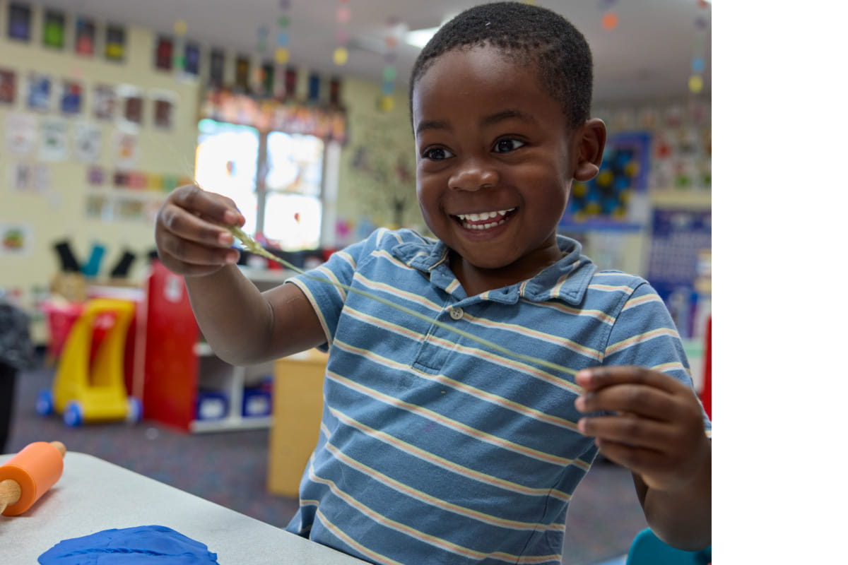 prekindergarten student smiling