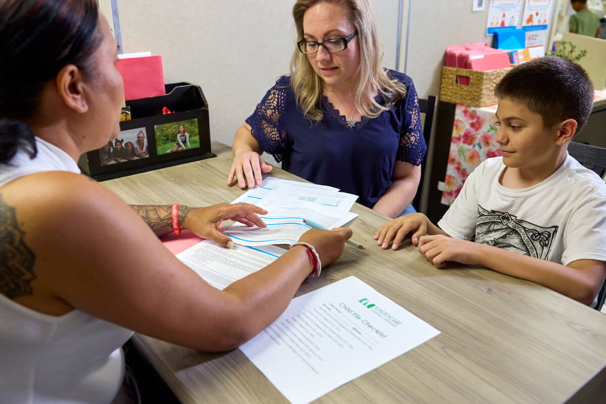 teacher and parent with student