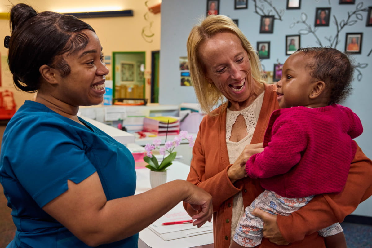 teacher and parent with baby