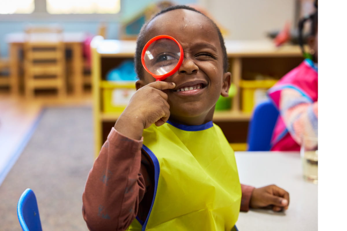 kid with magnifying glass