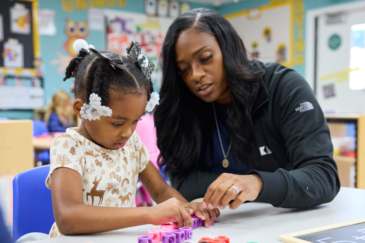 teacher and preschool kid