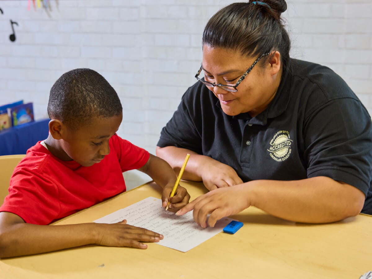 teacher and student doing homework